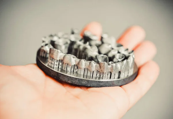 Man is holding object printed on metal 3d printer. — Stock Photo, Image