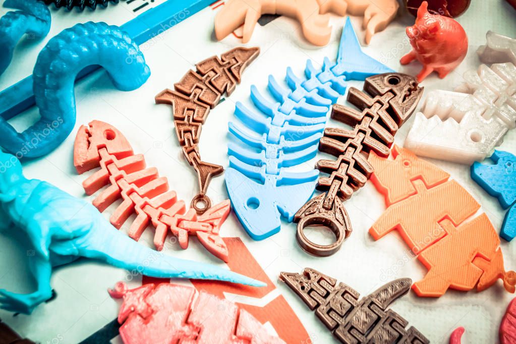 Models printed by 3d printer. Bright colorful objects printed on a 3d printer