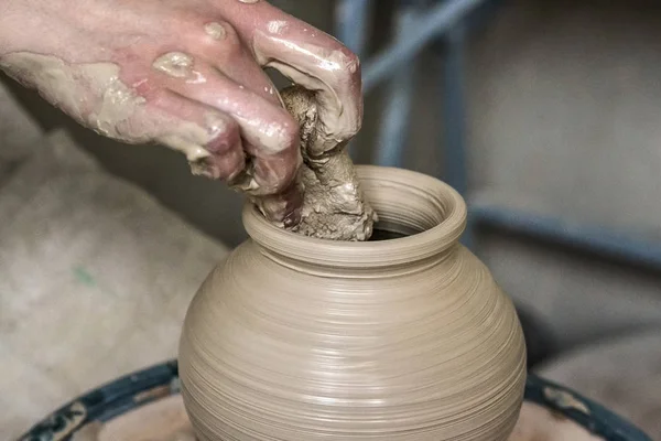 Man hands and tool making clay jug macro. — Stock Photo, Image