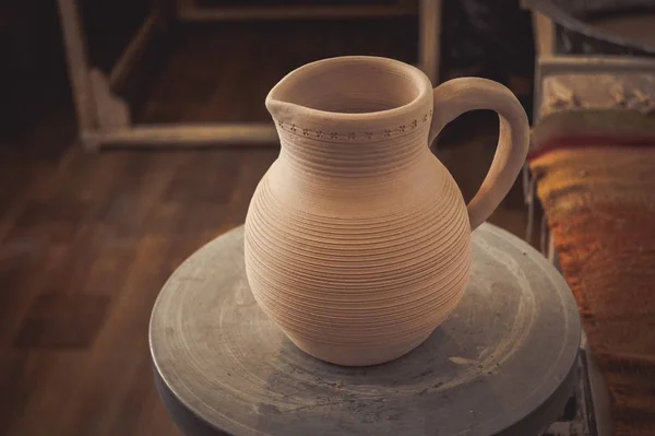 Clay jug on a potters wheel — Stock Photo, Image