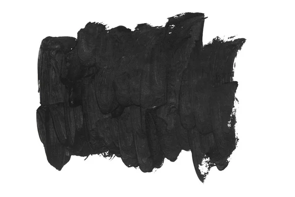 Zwarte penseelstreken op wit papier geïsoleerd. — Stockfoto