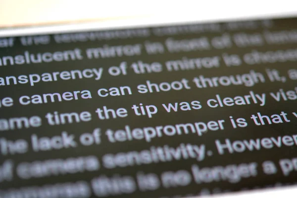 Teleprompter automatically scrolls text close-up. — Stock Photo, Image