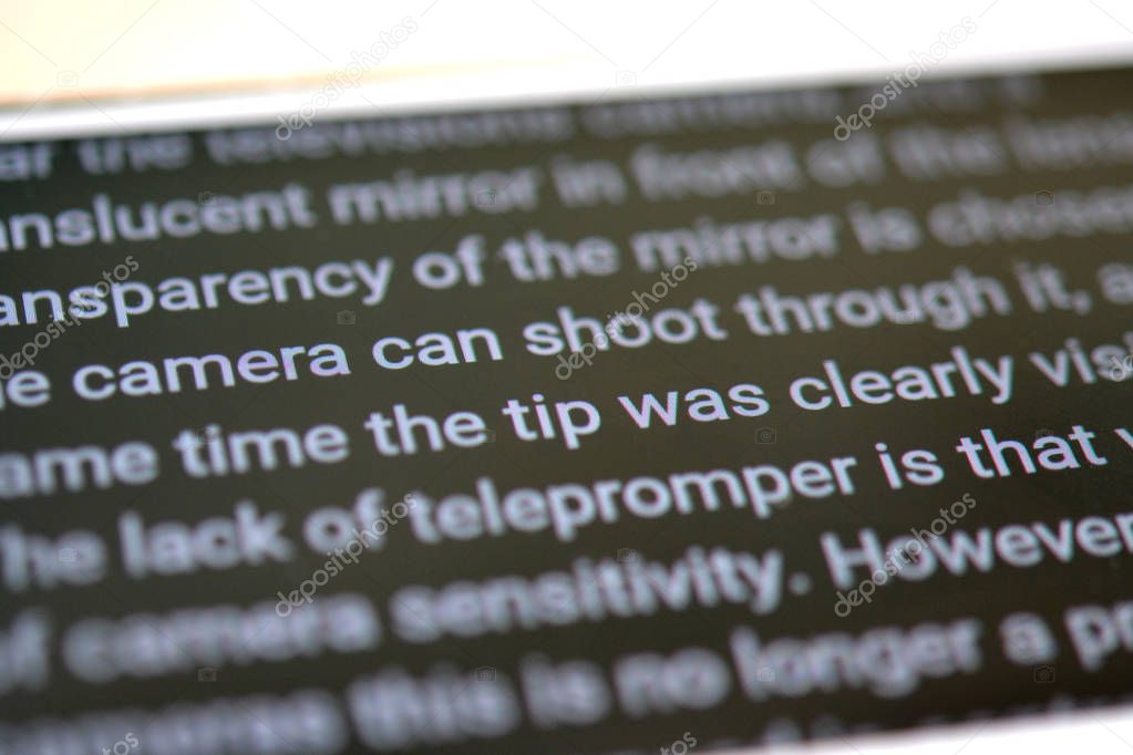 Teleprompter automatically scrolls text close-up.