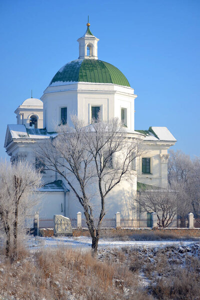 church with white walls and green dome