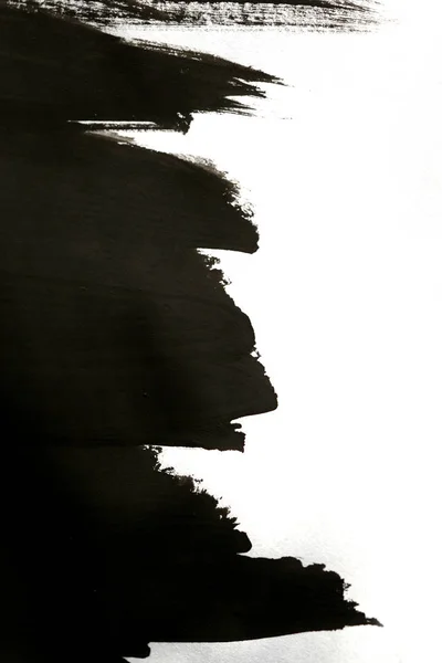 Чорні мазки пензлем на білому папері з однією рукою ізольовані — стокове фото