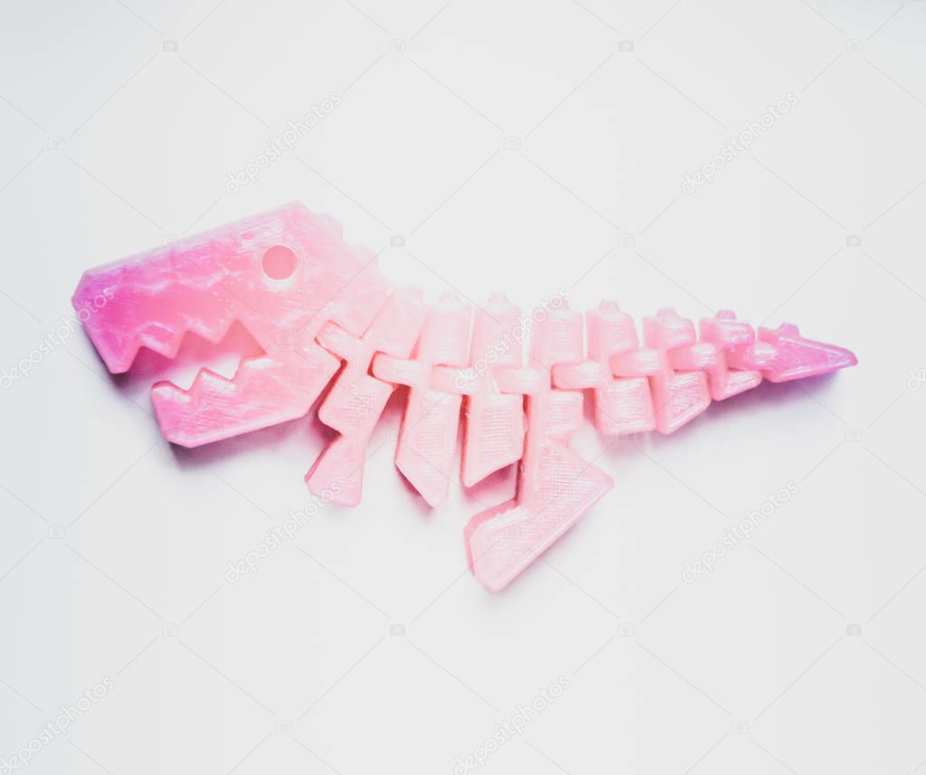 Bright light pink object in shape of dinosaur toy printed on 3d printer