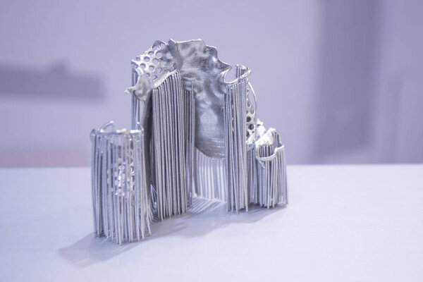 Dental crowns printed in laser sintering machine. Modern 3D printer