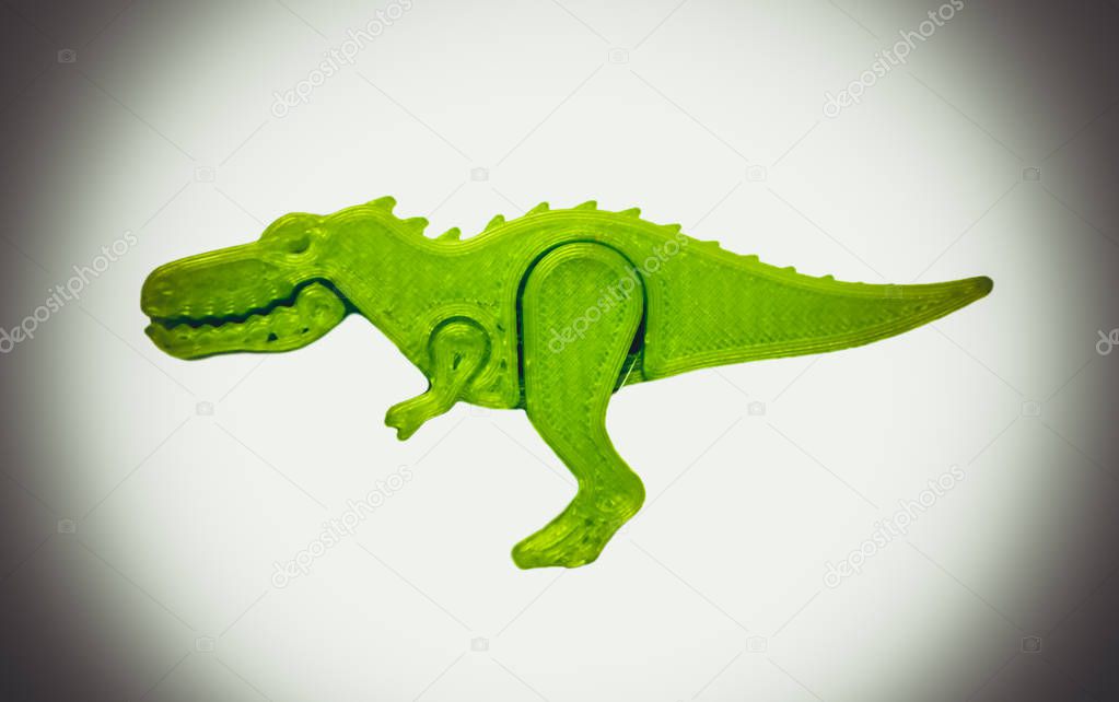 Bright light green object in shape of dinosaur toy printed on 3d printer
