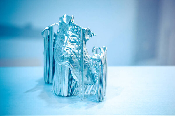 Dental crowns printed in laser sintering machine. Modern 3D printer