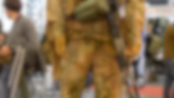 Blurred background. Mannequin dressed various body armor — Stock Video