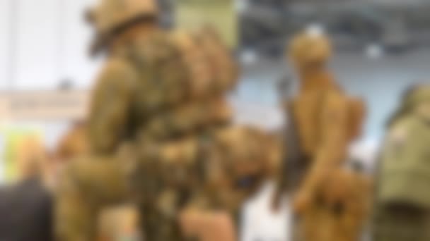 Blurred background. Mannequin dressed various body armor — Stock Video