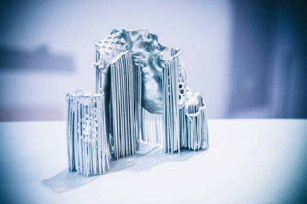 Dental crowns printed in laser sintering machine. Modern 3D printer