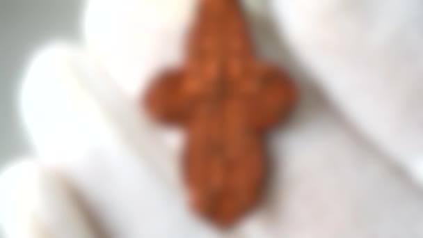 Blurred background. ancient cross archaeological find White background — Stock Video