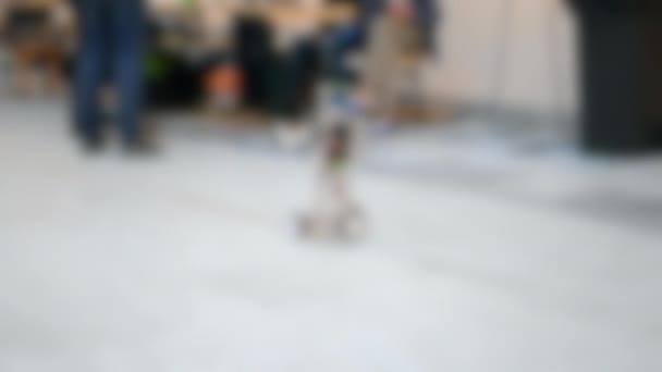 Blurred background. Toy robots prototypes close-up concept automation background — Stock Video