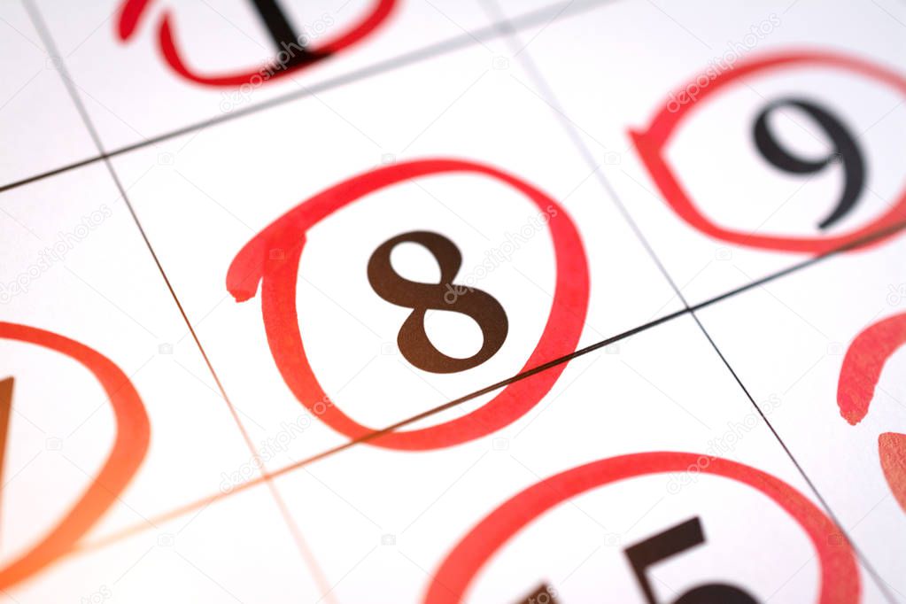 Red circle marked with pen on a calendar sheet 8 date