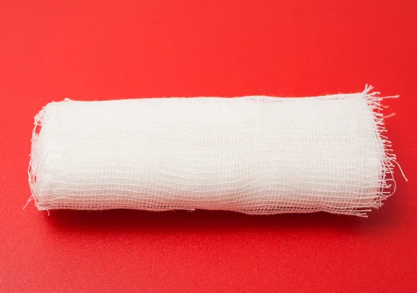 Medical Bandage Roll Red Background — Stock Fotó