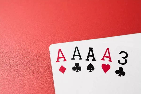 Manos de póquer jugando cartas cuatro de una clase — Foto de Stock