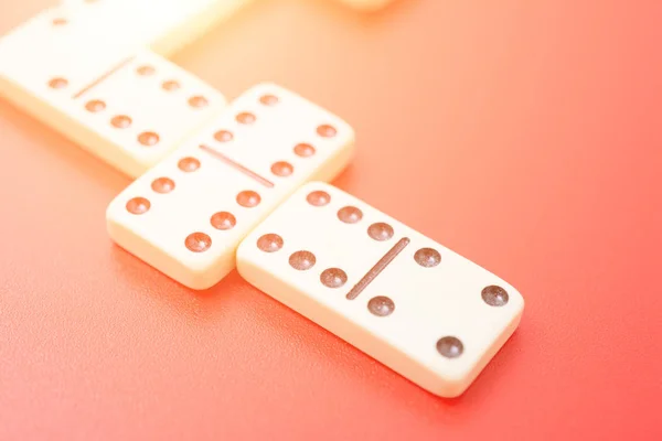 Dominoes on red table — Stock Photo, Image