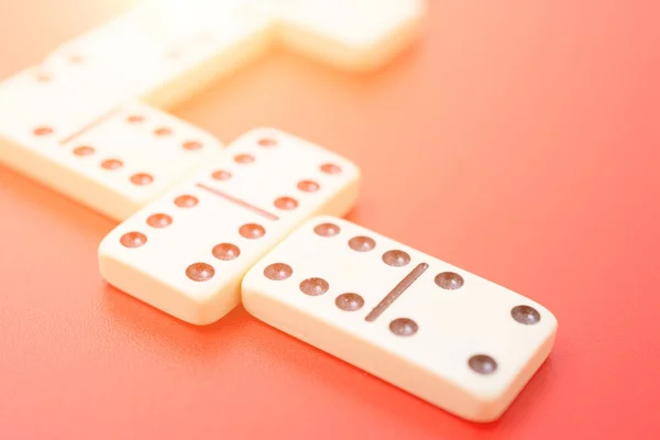 Dominoes on red table — Stock Photo, Image