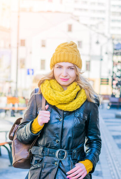 beautiful young woman walking on the street