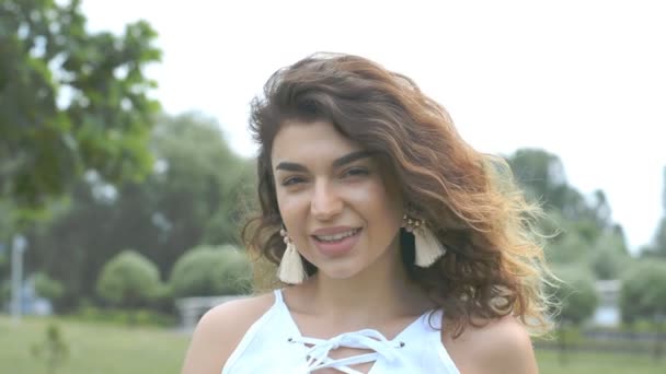 Close up portrait of pretty smiling Young Mixed Race Woman with curly hair, smiling face — Stock Video