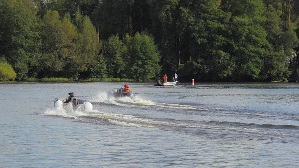 A many inflatable motor boats fast floating on racing track on lake, summer water outdoor sports competition — Stock Image Many Inflatable Motor Boats Fast Floating Racing Track Lake Summer Royalty Free Stock Images