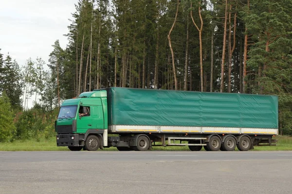 Green Awning Semi Truck Drive Next Aspheleveled Country Road Forest — стоковое фото