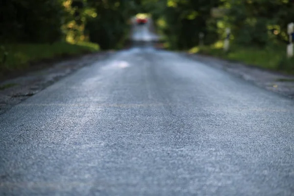 Asphalt road after the rain in the evening — Stock Photo, Image