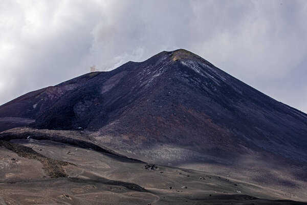 huge crater with frozen lava on Mount Etna