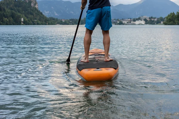 stand up paddle boarding on the lake