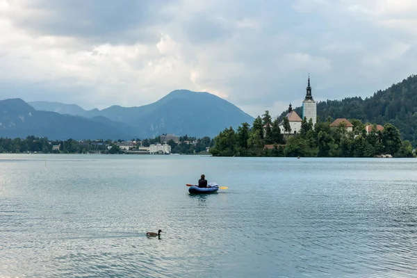 man in boat on lake Bled