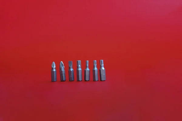 Screwdrivers Bits Construction Metal Repairs Uniform Red Background Workspace — Stock Photo, Image