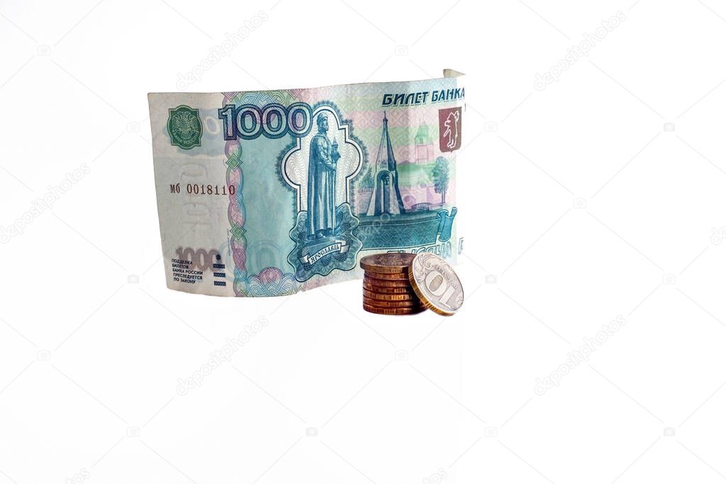 Russian banknotes and coins on a white background, layout for the workspace