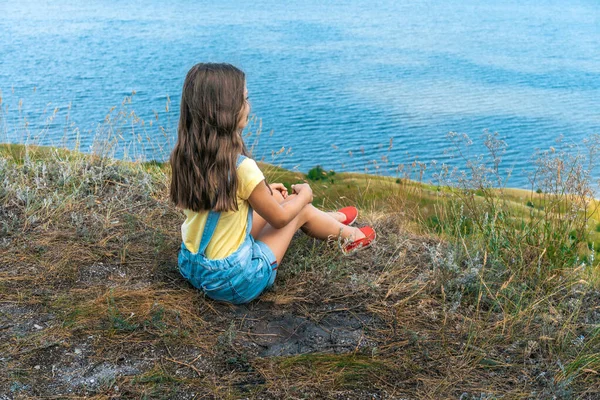 Charming Little Girl Child Curly Hair Denim Jumpsuit Sits Edge — Stock Photo, Image