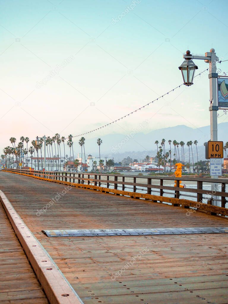  Wooden floor made of beams on a pier on the Santa Barbara waterfront, California at sunset