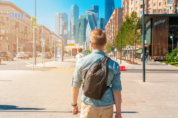 Man Backpack Walks Streets City Business Center Skyscrapers — Stock Photo, Image