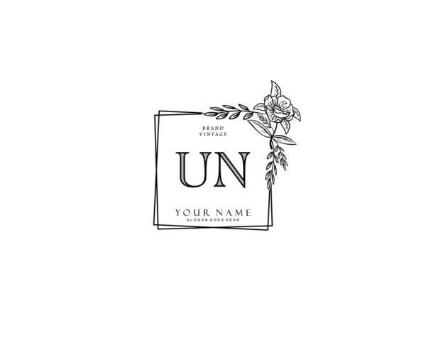 初期の国連の美しさのモノグラムとエレガントなロゴデザイン 創造的なテンプレートと初期の署名 結婚式 ファッション 花や植物の手書きのロゴ — ストックベクタ