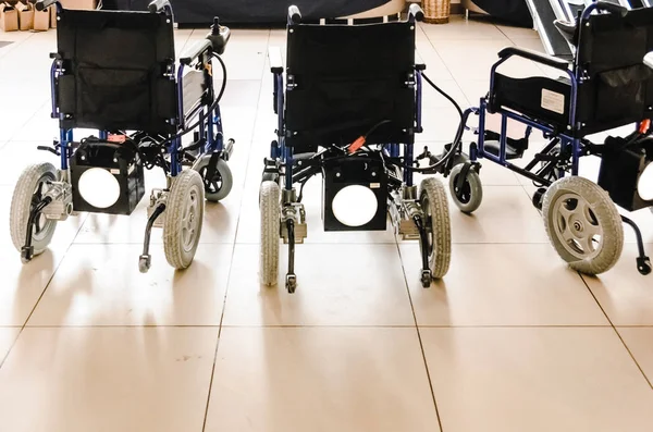 wheelchairs with electric drive new, standing on the floor