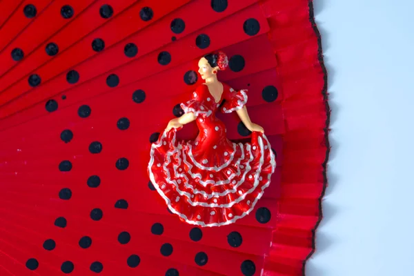 miniature figure of a dancer in combination with women\'s things-fan, lipstick, perfume, beads