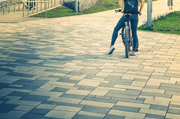 people walking along the promenade, Biking and scooters, watching the water flowing river or sea