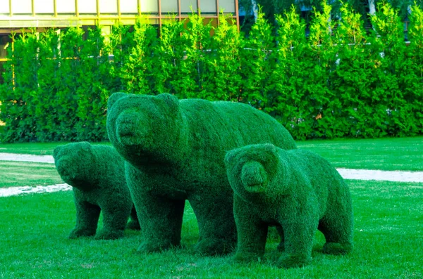 a green three-dimensional figures bears
