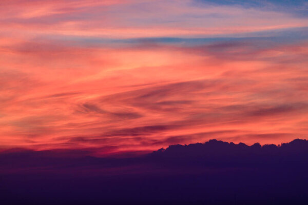 Red sky and clouds at sunset in the evening