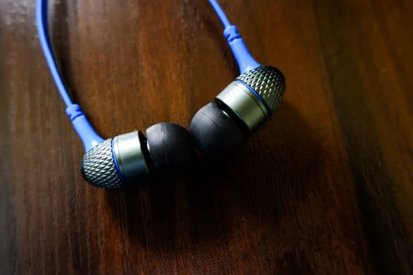 Closeup View Headphone Earbuds Isolated Wooden Texture Table — Stock Photo, Image