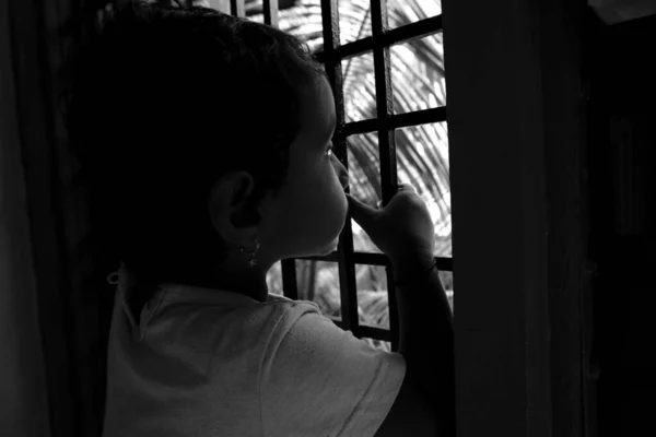 Close Shot Indian Girl Child Peeping Window Nature Monochrome Photo — стоковое фото