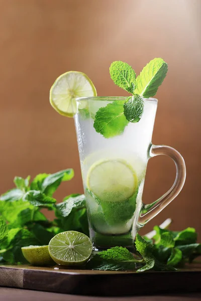 Fresh lime juice or lemon juice, limes slice and mint on the table.
