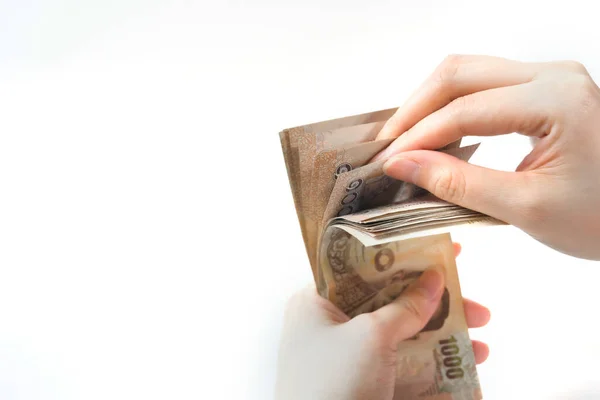 网幅货币收入与女性手头上投资概念 以白色孤立背景的泰国人钞票为代表 — 图库照片