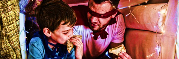 Father Son Pretending Superhero While Eating Sandwich — Stock Photo, Image