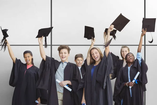 Studenten Houden Mortarboards Tegen Witte Tegels — Stockfoto