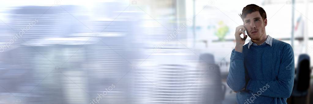 Digital composite of Businessman on phone in office with city transition