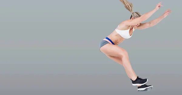 Ψηφιακός Σύνθετος Από Αθλητικό Άλμα Γυναίκα Ταιριάζει Κενό Γκρι Φόντο — Φωτογραφία Αρχείου